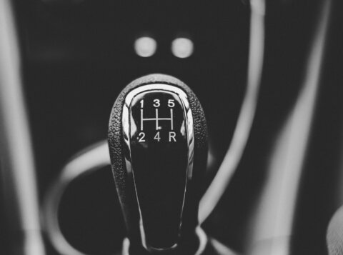 focus photography of car shift gear