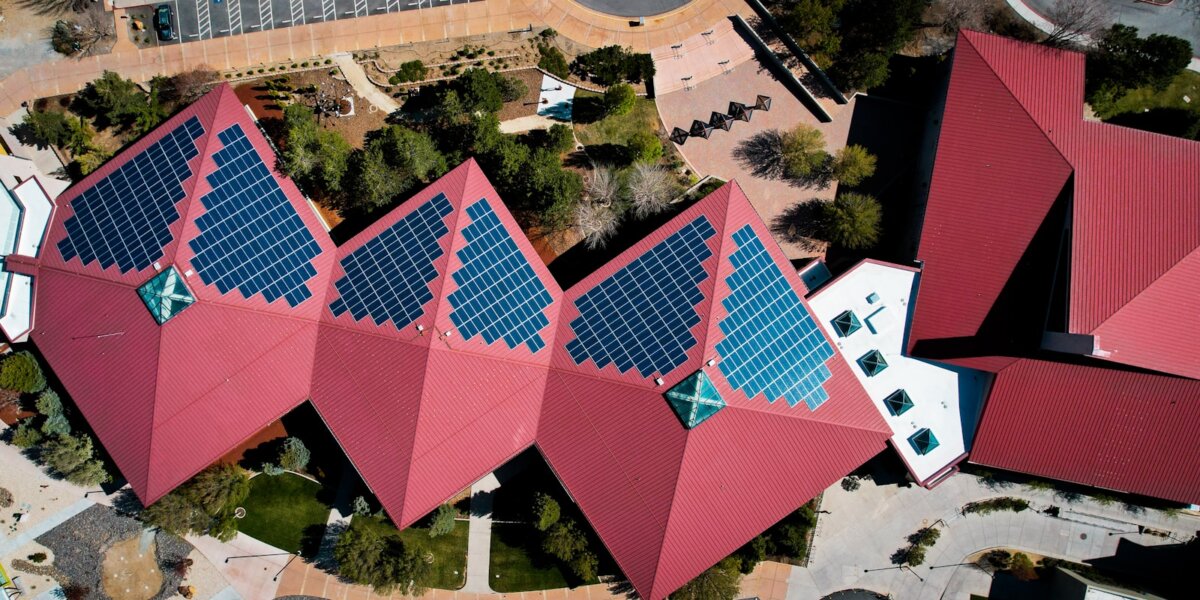 a group of buildings with red roofs