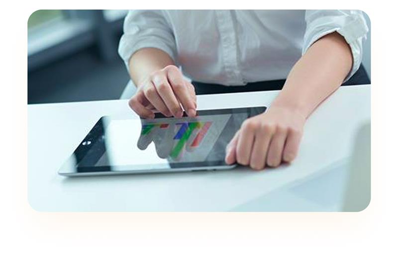 Closeup of a person's hands navigating a data visual on a tablet