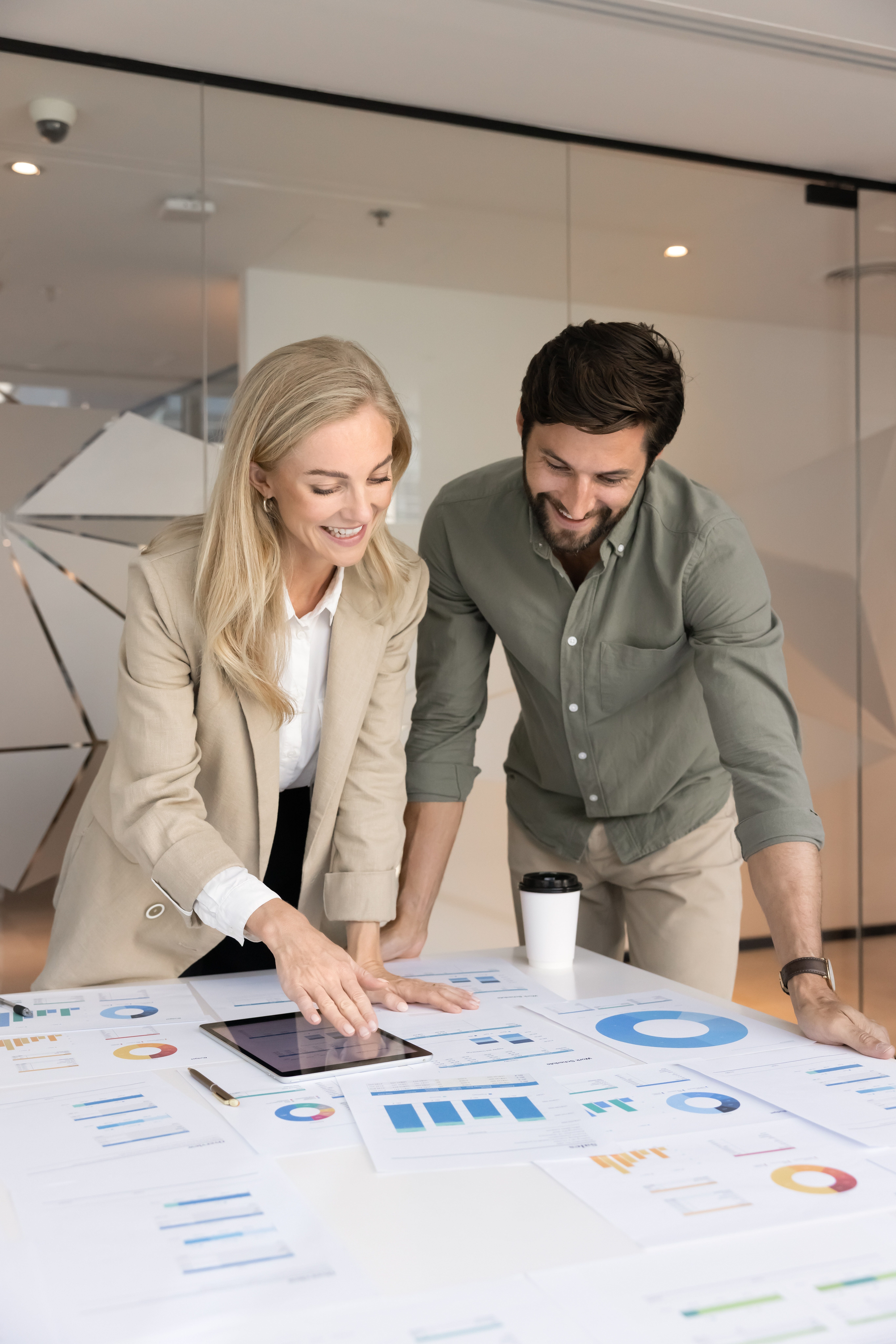 TwoPositiveMarketingAgencyAnalystsDiscussingPaperDiagramsOnMeeting - AArete Two people road mapping a strategy